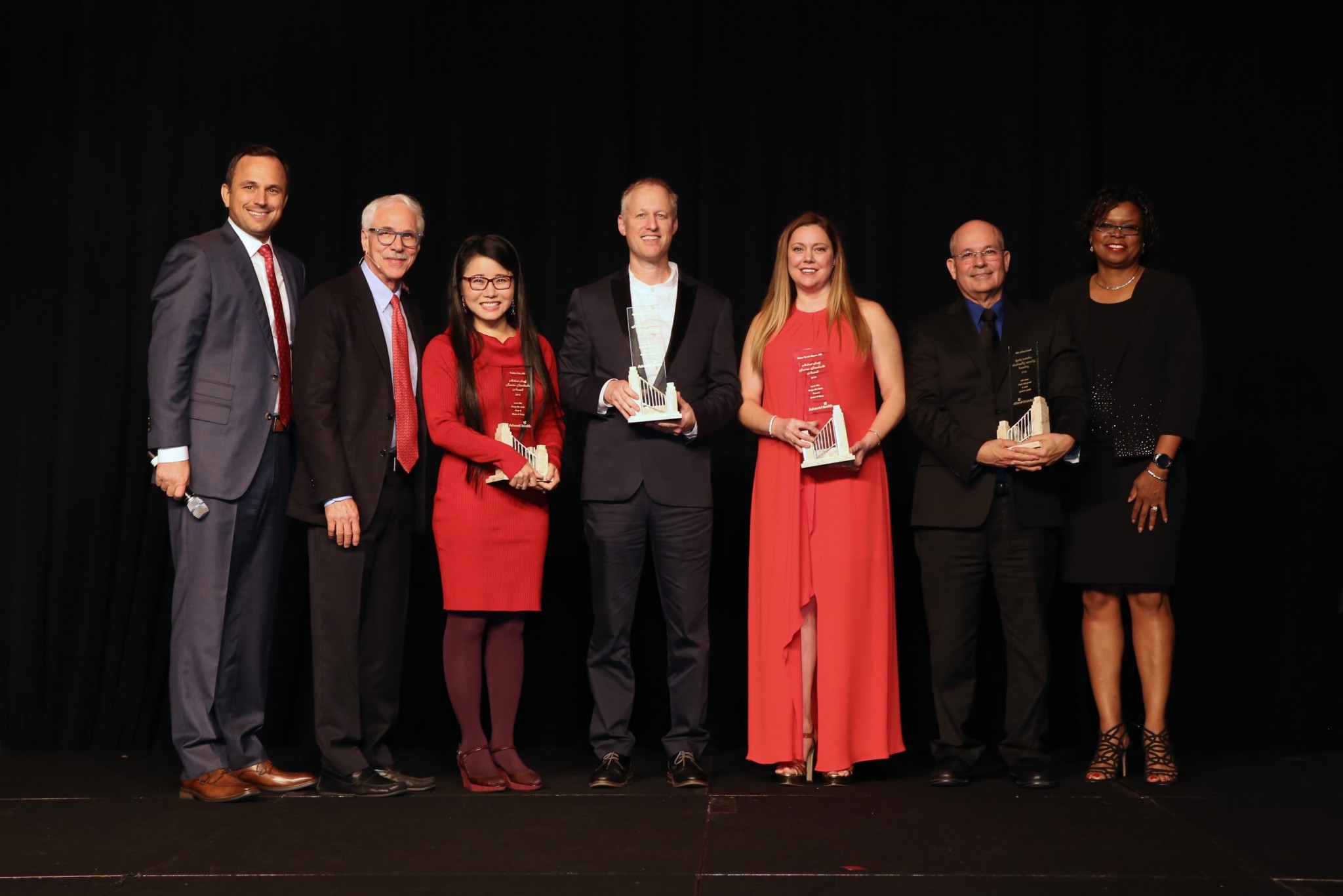Daryl Tol - CEO of AdventHealth Central Florida, Neil Finkler, MD - Chief Medical Officer of AdventHealth Orlando, and Tanya Agard, MD - President of Advent Health Orlando Medical Staff present the AdventHealth Service Standards Values Award to Puxiao Cen, MD (Transplant Cardiologist), Brian Specter, MD (ENT Ear Nose and Throat surgeon), Dr Reina Mayor, MD (Pediatrician), and Raul Castillo, MD (Hematologist and Oncologist). Daryl Tol - CEO of AdventHealth Central Florida, Neil Finkler, MD - Chief Medical Officer of AdventHealth Orlando, and Tanya Agard, MD - President of Advent Health Orlando Medical Staff present the AdventHealth Service Standards Values Award to Puxiao Cen, MD (Transplant Cardiologist), Brian Specter, MD (ENT Ear Nose and Throat surgeon), Dr Reina Mayor, MD (Pediatrician), and Raul Castillo, MD (Hematologist and Oncologist).