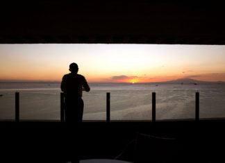 President Obama Celebrates Filipino American History Month The President watches the sun set over Manila Bay from his hotel balcony in Manila. (Official White House Photo by Pete Souza)