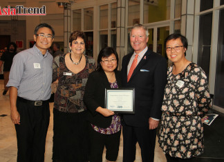 Award Ceremony Highlights Success of Orlando Main Street Districts Mayor Buddy Dyer with the organizers of the Dragon Parade Lunar New Year Festival